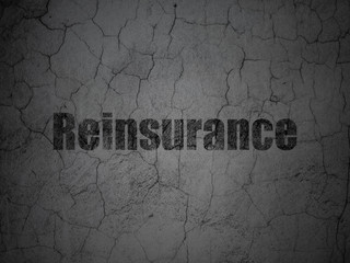 Insurance concept: Black Reinsurance on grunge textured concrete wall background