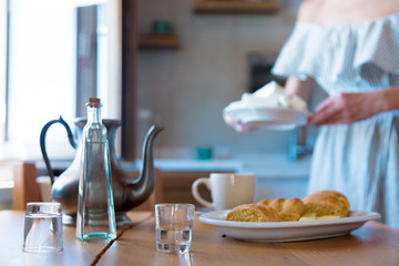 Traditional Crete breakfast, bread, cheese and coffee on wooden table on a kitchen. Crete, Greece