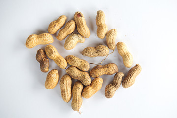 group of peanuts on a white plate