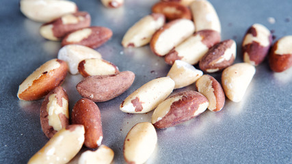 group of brazil nuts on silver plate