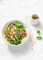 Soba noodles vegetables pad thai on light background, top view. Vegetarian food in asian style