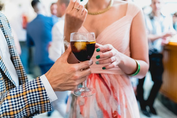 Glasses of champagne served from the bottle at a wedding