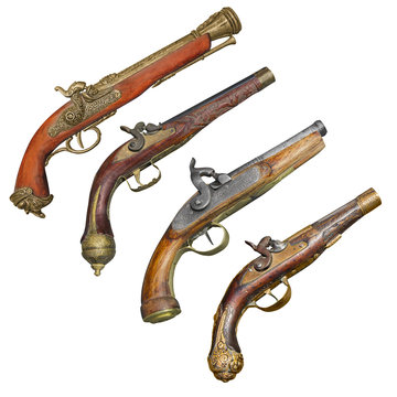 Four old vintage firelock gun isolated on white background