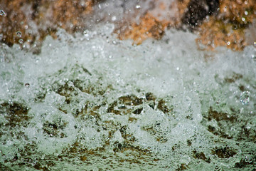 Water with spray and foam is macro