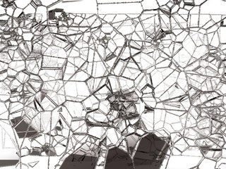 Pieces of shattered or cracked glass on white