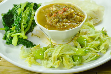 horseshoe crab chili paste eat couple with variety boiled vegetable on plate