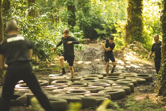 Fit mens training over tyres obstacle course