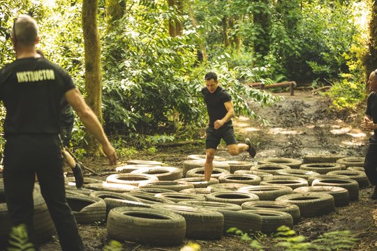 Fit mens training over tyres obstacle course