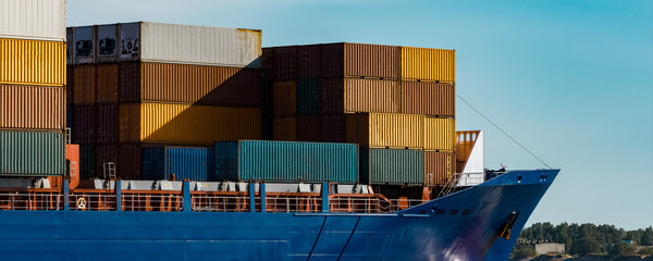 Blue container ship underway