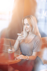 Beautiful Young Woman with Fruit smoothie