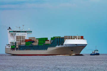 Grey container ship underway