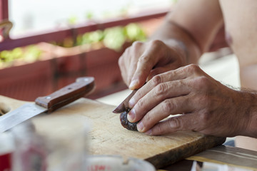 cuts sausage, close up