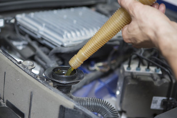 People are repair a car Use a wrench and a screwdriver to work.Safe and confident in driving