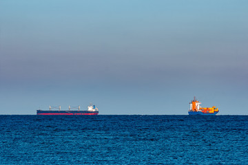 Blue container ship underway