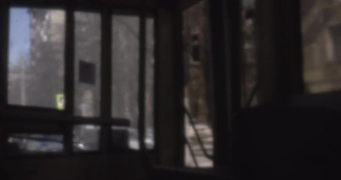Archival footage of bus driving through Moscow city, view from inside. Russia circa 1980