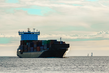 Black container ship underway