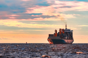 Blue container ship underway