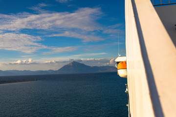 View of the Greek island of Makri from the ferry at sunset. Greek islands in the Ionian Sea