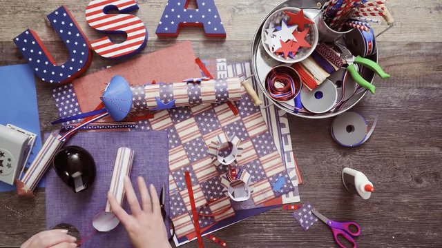 Time lapse. Step by step. Mother and daughter making paper lantern for July 4th celebration