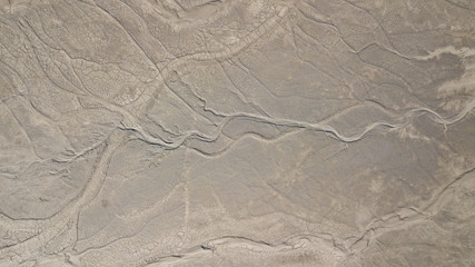 Fototapeta na wymiar Aerial view of a muddy lake texture.
