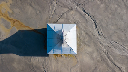 Aerial view of an old church that was flooded, along with an entire village, under chemical waste in Romania.