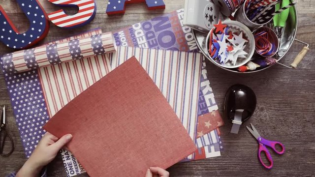 Time lapse. Step by step. Mother and daughter making paper firecrackers for July 4th celebration