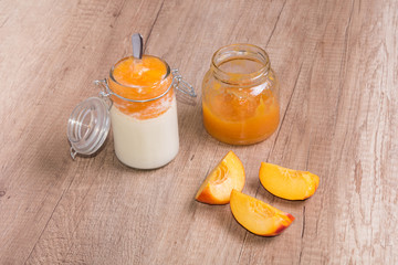 Zero waste health meal homemade yogurt and peach jam on wooden table