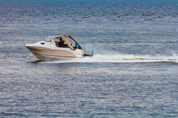 Fototapeta na wymiar White speed boat in action