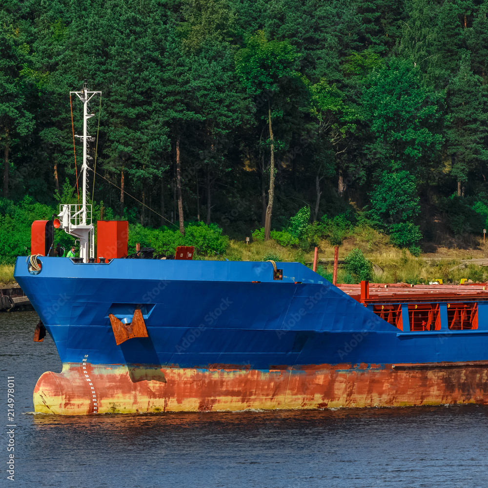 Wall mural Blue cargo ship