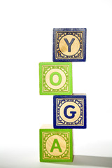 Wooden block letters spelling out the word yoga