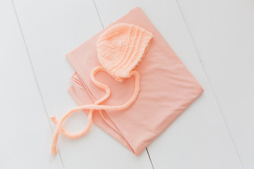 a hat and a diaper for the baby. hat for a newborn. peach-colored diaper