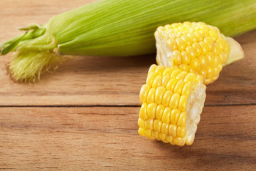 Fresh corn on wood desk