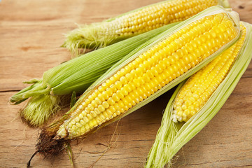Fresh corn on wood desk