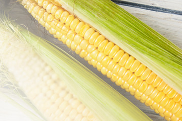 Fresh corn on wood desk