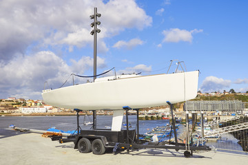 Fototapeta na wymiar Repair pier. Boat in shipyard for repair