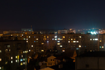 Long exposure photo big city life at night. High view above the city.