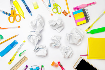 paper balls on the school desk.The concept of generated ideas, inventing new ideas. Searching of decisions. Bad idea. education process. stationery. top view. flat lay
