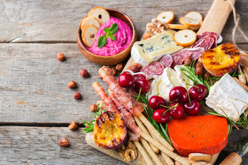 Assortment of spanish tapas or italian antipasti with hummus