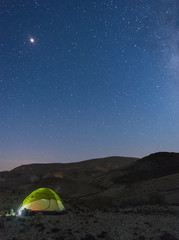 Fototapeta na wymiar Tent under stars in desert vacation