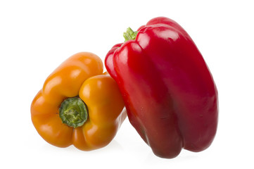 colored peppers close up over white background
