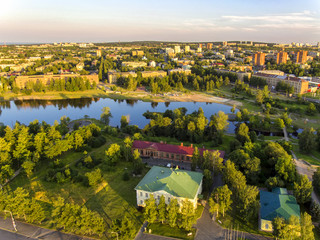 Aerial panorama of city and river from bird high in summer