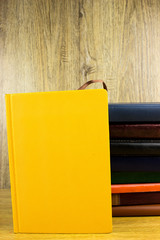 Books and notepads on a table. School knowledge and education concept.