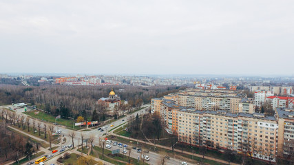 Beautiful small town with a bird's-eye view in early spring, park and church. aerial view Ternopil. Ukraine