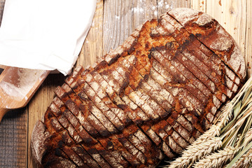 bread cutted on board from above. Kitchen or bakery poster design