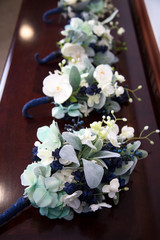 Bridesmaids Handmade Flowers on a Wooden Table for a Wedding