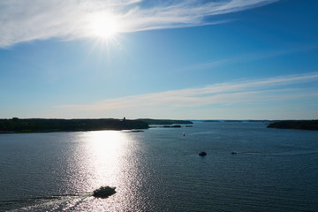 A boat in sunlight on a sunset. Backlight. Archipelago near Naantali, Finland.     