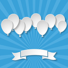 blue background with sun rays, paper balloons and a paper ribbon