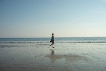 Woman walking on the beach