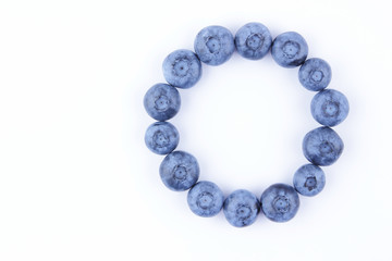 Blueberries on white background, blueberry berries isolated, blue berries close-up, blank for designer, vegetarian food