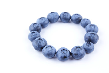 Blueberries on white background, blueberry berries isolated, blue berries close-up, blank for designer, vegetarian food